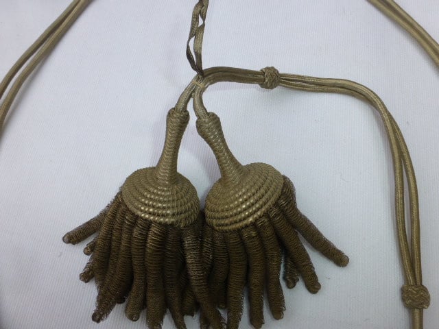 Vangsnoer met 2 zilver kleurige kwasten