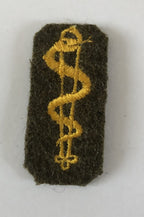 Mouwembleem gewonden verzorger KL 1950